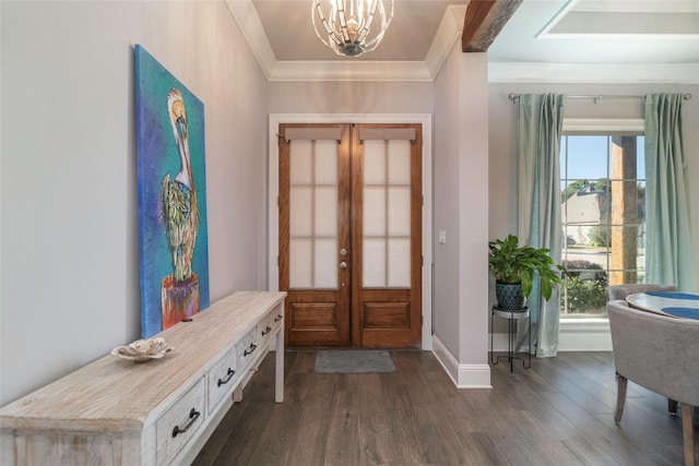 entrance foyer with french doors, dark hardwood / wood-style flooring, an inviting chandelier, and ornamental molding