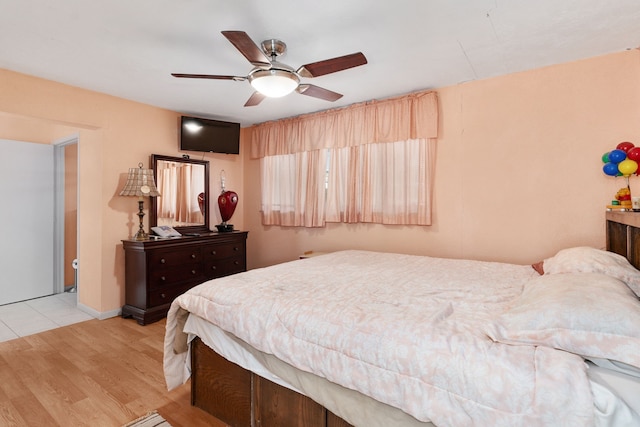 bedroom featuring ceiling fan and light hardwood / wood-style floors