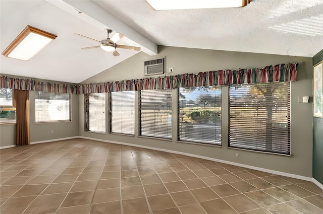 tiled empty room featuring lofted ceiling with beams, a textured ceiling, and ceiling fan