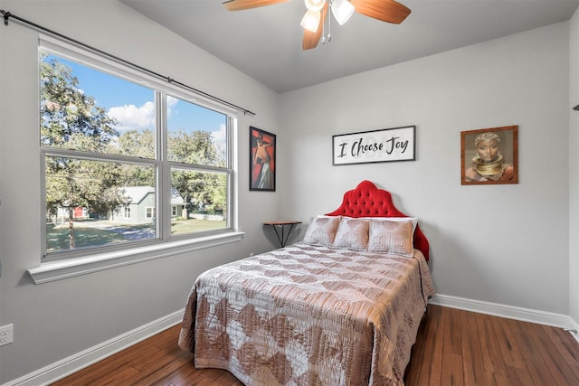 bedroom featuring dark hardwood / wood-style floors and ceiling fan