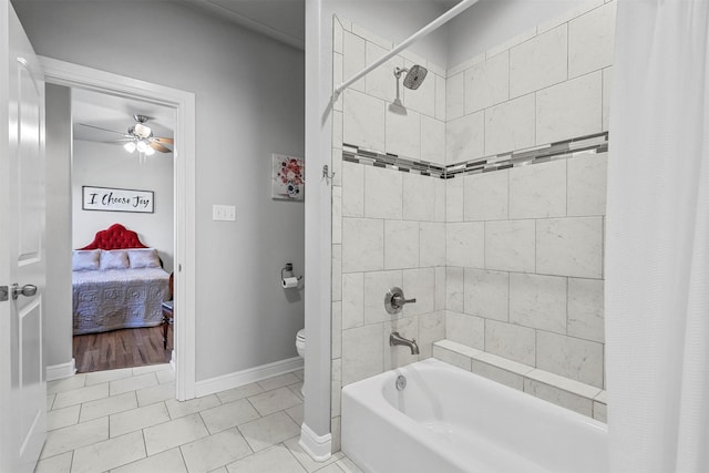 bathroom featuring tile patterned floors, ceiling fan, toilet, and shower / tub combo with curtain