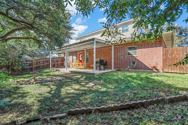 rear view of property featuring a patio area