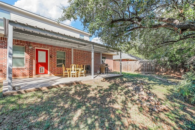 view of yard featuring a patio and a fenced backyard