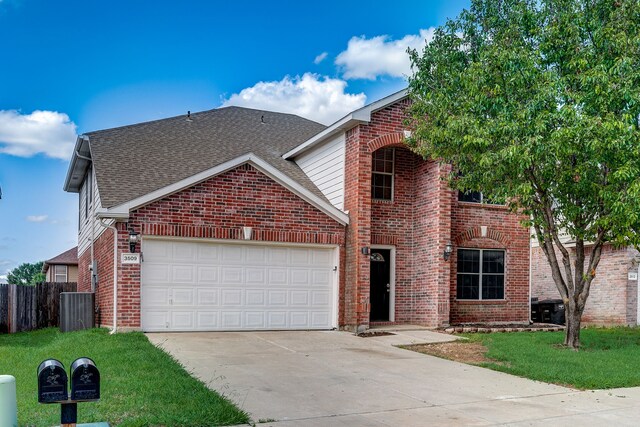 view of front property with a garage and a front lawn