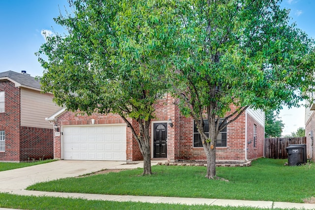 view of property hidden behind natural elements with a front lawn and a garage