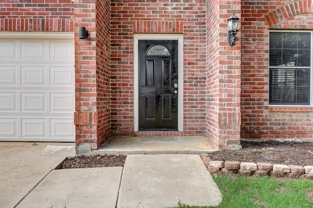 property entrance with a garage