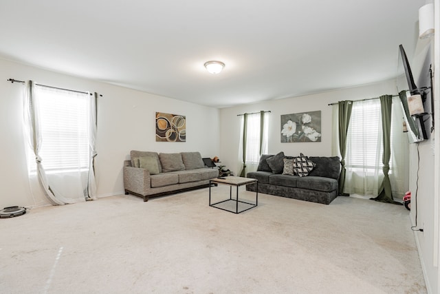 living room with a wealth of natural light and light colored carpet