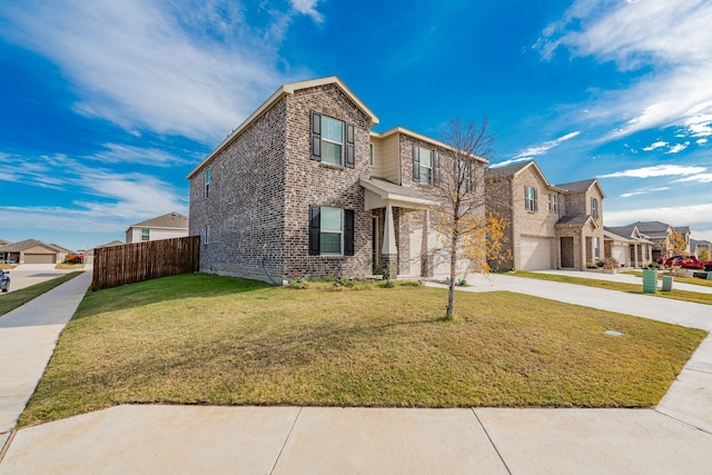 view of front of property with a garage and a front lawn