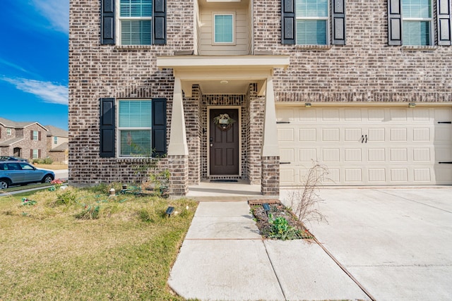 doorway to property featuring a garage