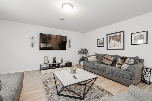 living room with light hardwood / wood-style flooring