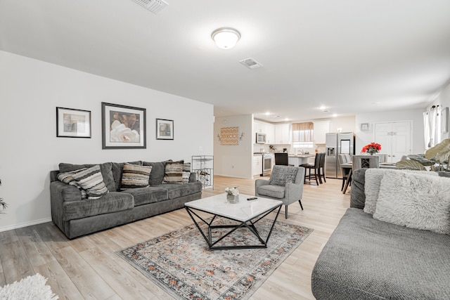 living room with light wood-type flooring