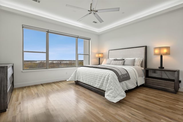 bedroom with hardwood / wood-style flooring and ceiling fan