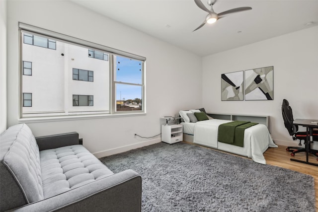 bedroom featuring hardwood / wood-style flooring and ceiling fan