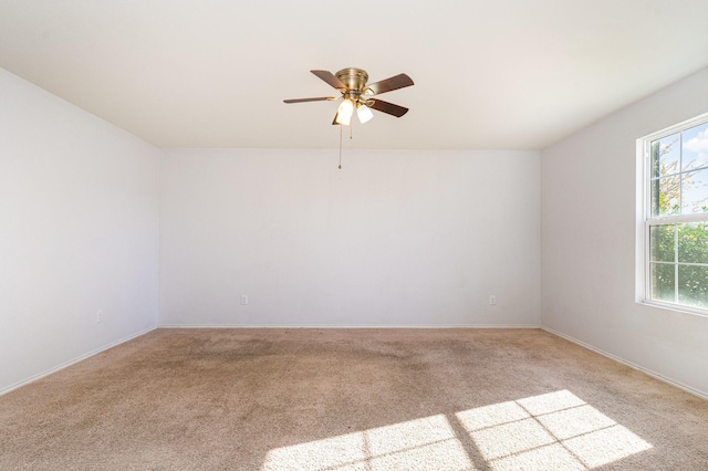 carpeted empty room with ceiling fan