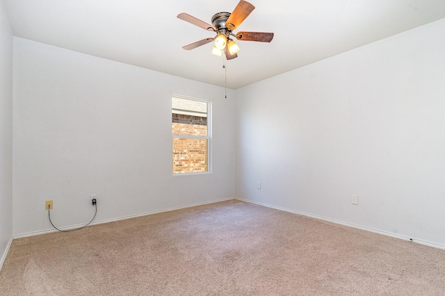 unfurnished room featuring ceiling fan and light colored carpet