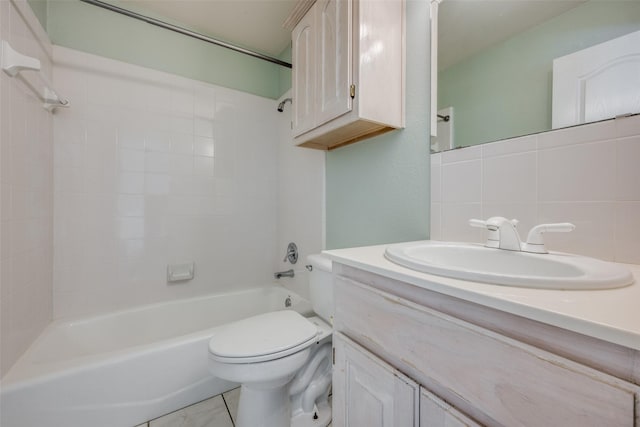 full bathroom featuring vanity, bathing tub / shower combination, decorative backsplash, toilet, and tile walls