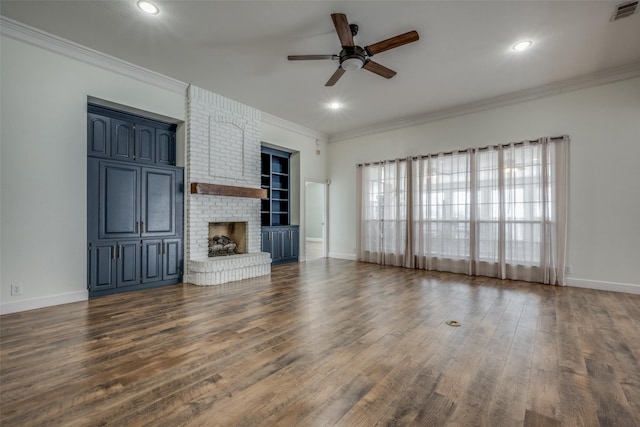 unfurnished living room with a fireplace, dark hardwood / wood-style flooring, ceiling fan, and ornamental molding