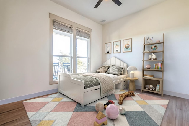 bedroom featuring light hardwood / wood-style flooring and ceiling fan