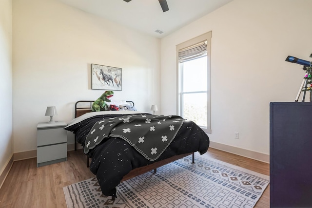 bedroom featuring ceiling fan and light hardwood / wood-style floors