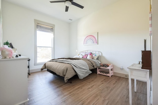 bedroom featuring ceiling fan and light hardwood / wood-style flooring