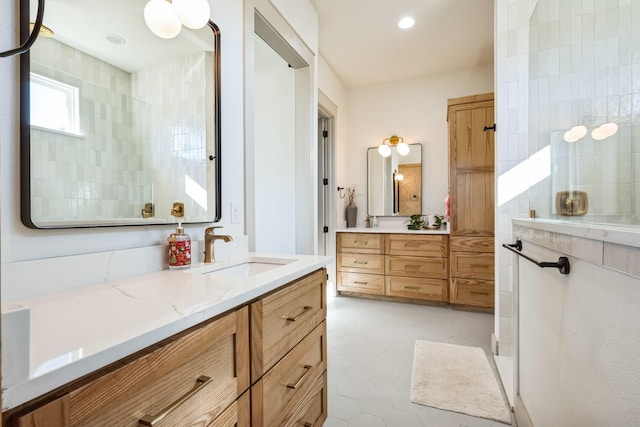 bathroom with vanity and a shower