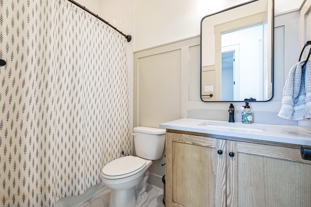 bathroom with vanity, walk in shower, and toilet