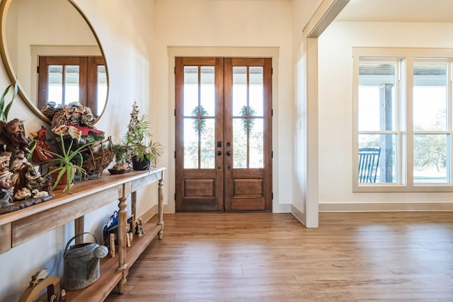 entryway with french doors and light wood-type flooring