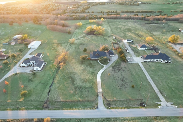 birds eye view of property with a rural view