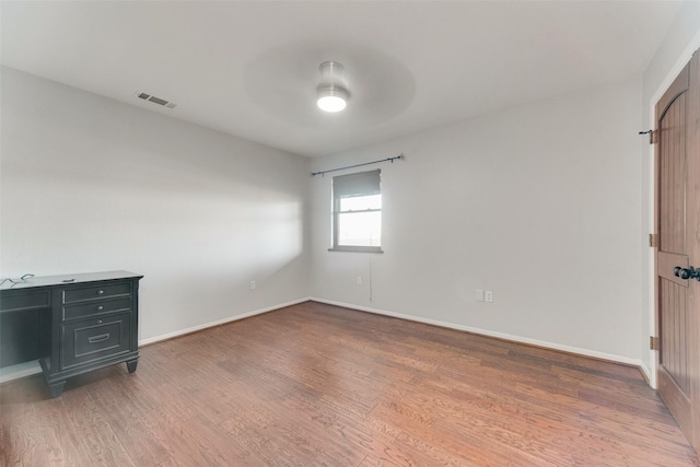 interior space featuring ceiling fan and dark hardwood / wood-style flooring