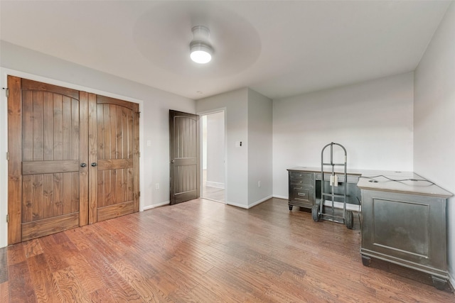 598 Dowell Rd, Rockwall, TX 75032 - interior space with wood finished floors, a desk, baseboards, and a ceiling fan