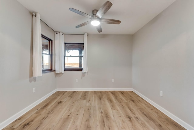 spare room with ceiling fan and light hardwood / wood-style flooring