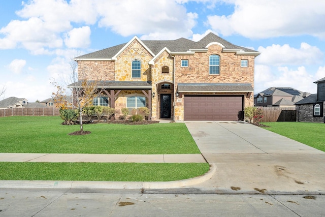 view of front of house with a garage and a front yard