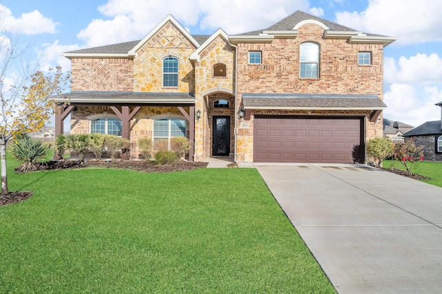 view of front of house with a garage and a front lawn