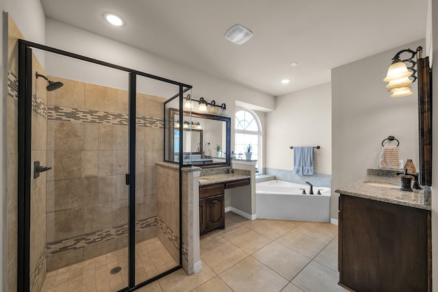 bathroom with tile patterned flooring, vanity, and independent shower and bath