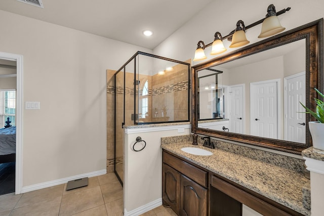 bathroom with vanity, tile patterned floors, and an enclosed shower