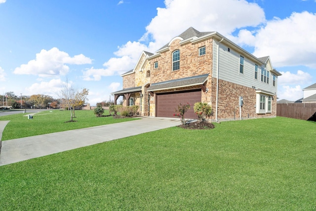 view of front facade with a front yard and a garage