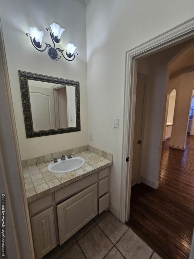 bathroom with tile patterned flooring and vanity