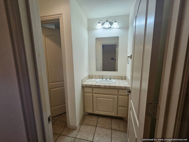 bathroom with tile patterned flooring and vanity