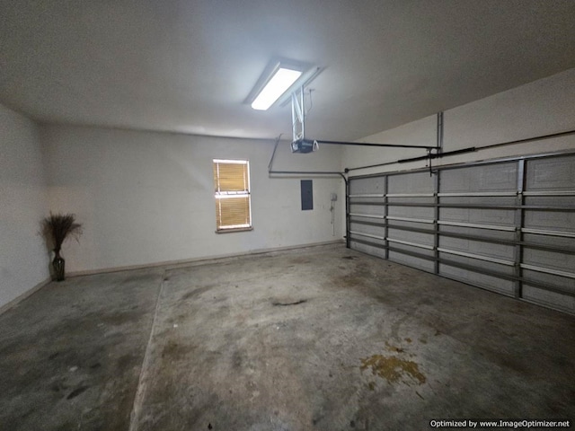 garage featuring electric panel and a garage door opener