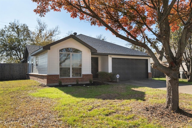 ranch-style house featuring a garage and a front yard