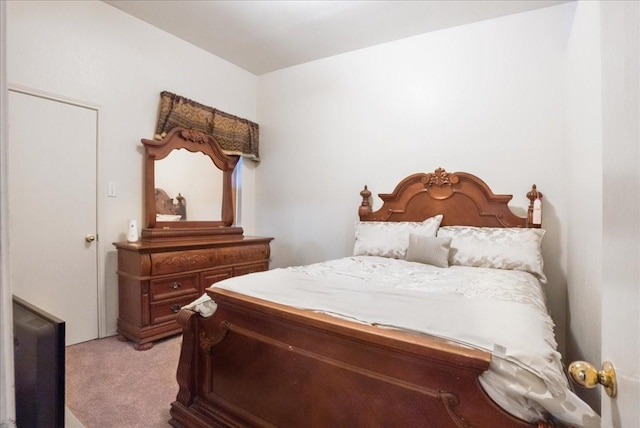 bedroom featuring light carpet