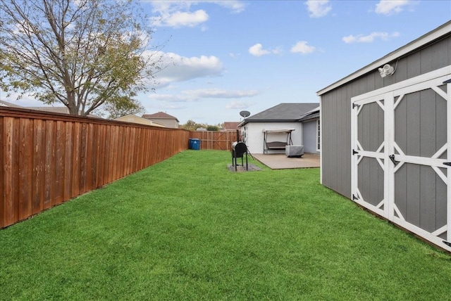 view of yard with a patio and a shed