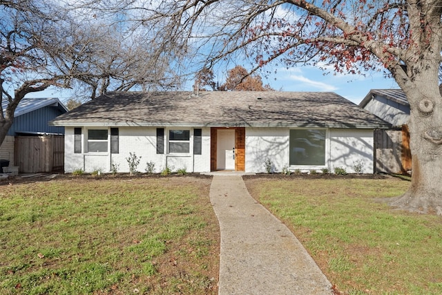 single story home featuring a front yard