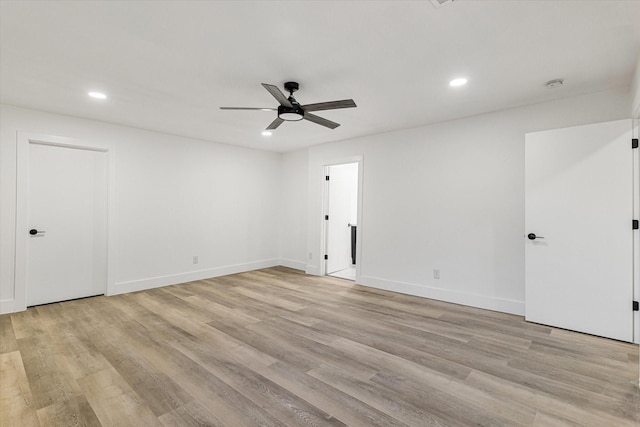 unfurnished room with ceiling fan and light hardwood / wood-style flooring