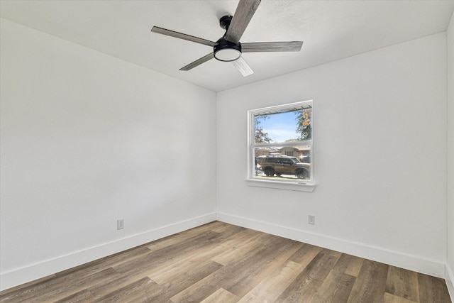 unfurnished room featuring light wood-type flooring and ceiling fan