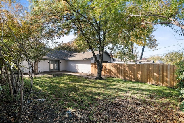 view of yard with french doors