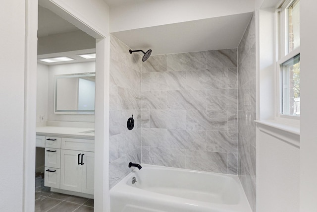 bathroom with vanity and tiled shower / bath