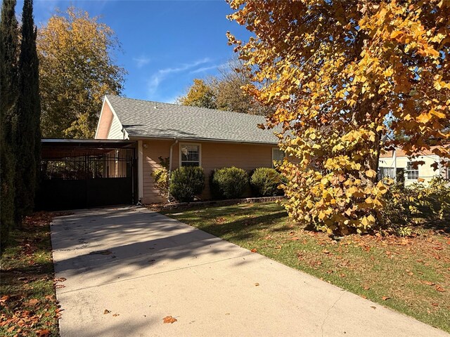 view of front of home featuring a carport