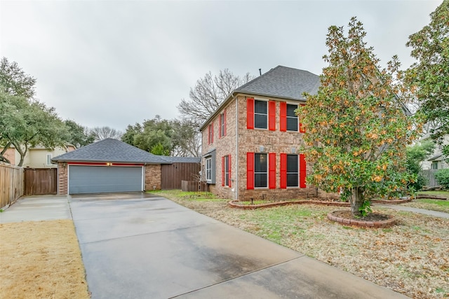 view of front facade featuring a garage and a front lawn