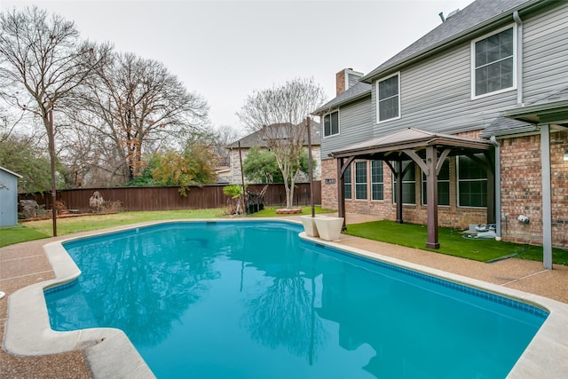 view of pool featuring a gazebo and a lawn